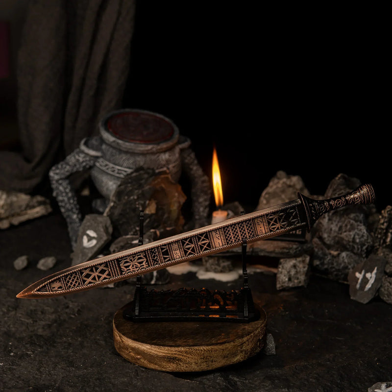 Regalia of Eochaid displayed horizontally on a large black sword stand.