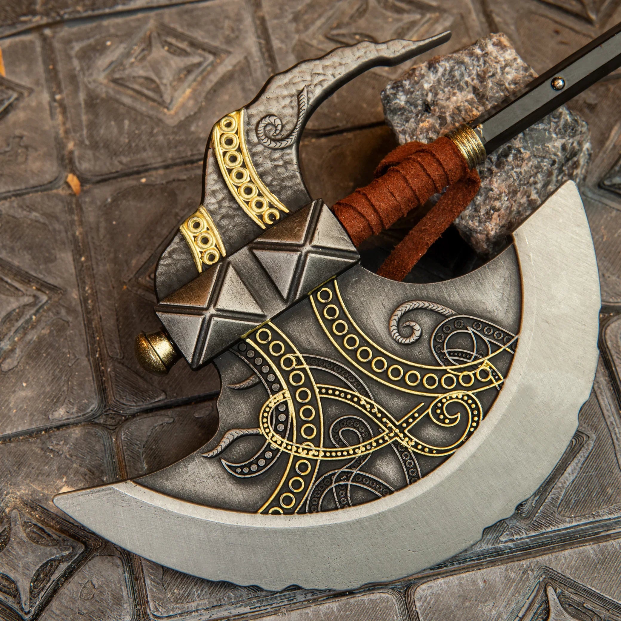 Axe of Godfrey replica — gold scrollwork, studded collar and wrapped grip in close-up.