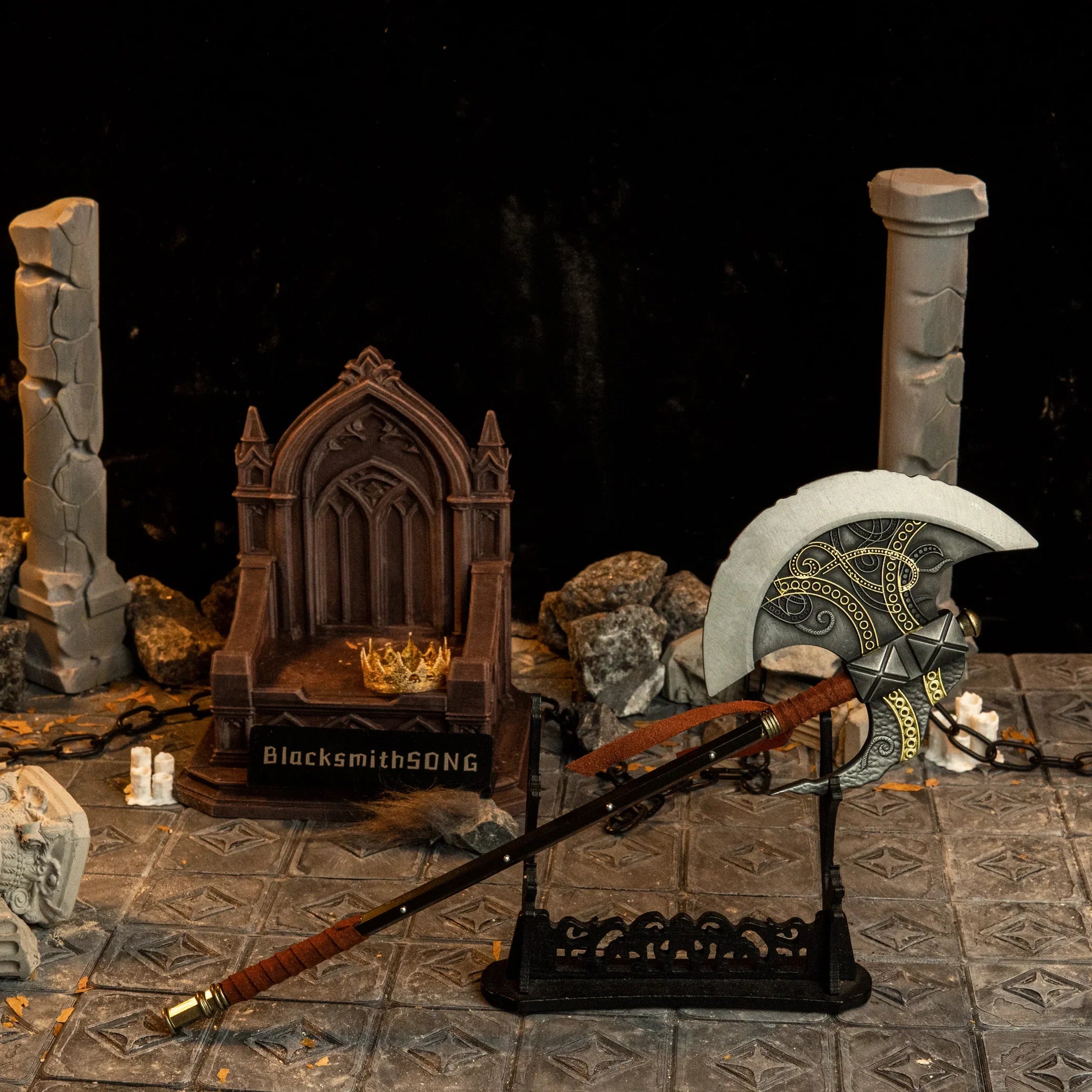 Axe of Godfrey replica — displayed on the large stand beside the throne set.