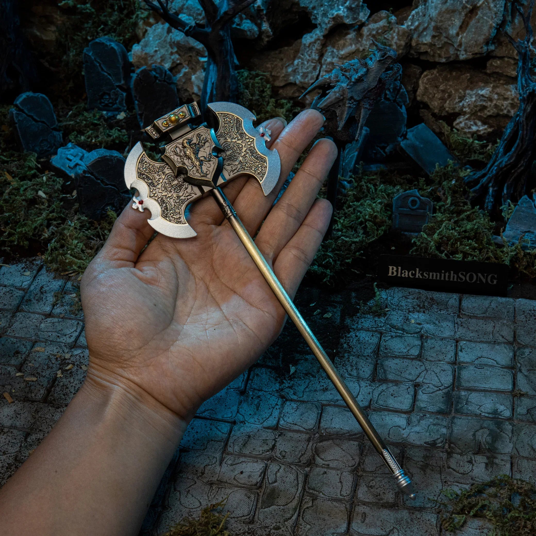 Axe of Godrick replica (23cm die-cast zinc alloy greataxe) — held in hand for scale.