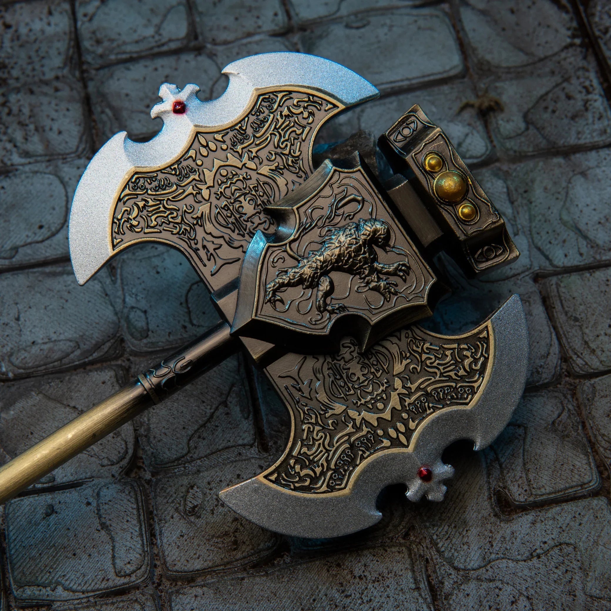 Axe of Godrick replica — twin crescent blades and knotwork engraving, overhead close-up.