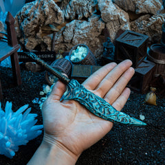 Crystal Knife replica (22cm die-cast zinc alloy dagger) — held in hand for scale.