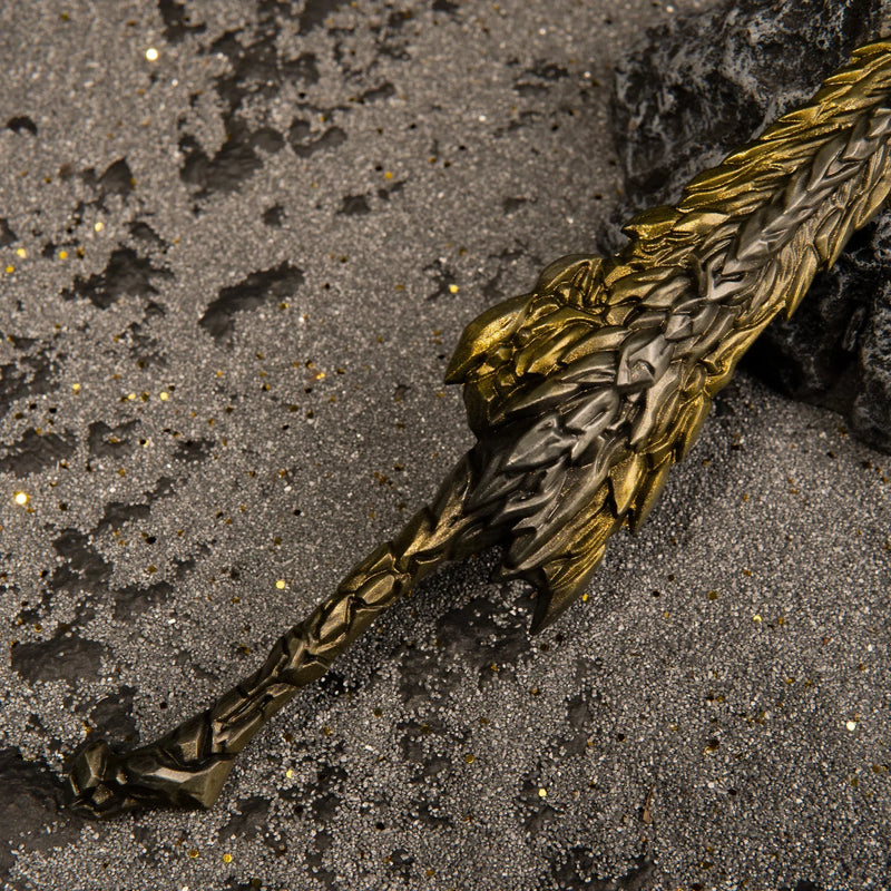 Close-up macro detail of the Dragon King's Cragblade hilt, showing the transition from the dark metal handle to the rough gold blade.