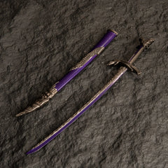 Dragonscale Blade metal katana replica and its purple scabbard isolated on a dark textured background.