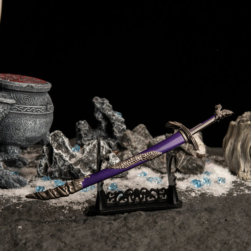 Dragonscale Blade displayed horizontally on a large black sword stand over a snowy rock background.