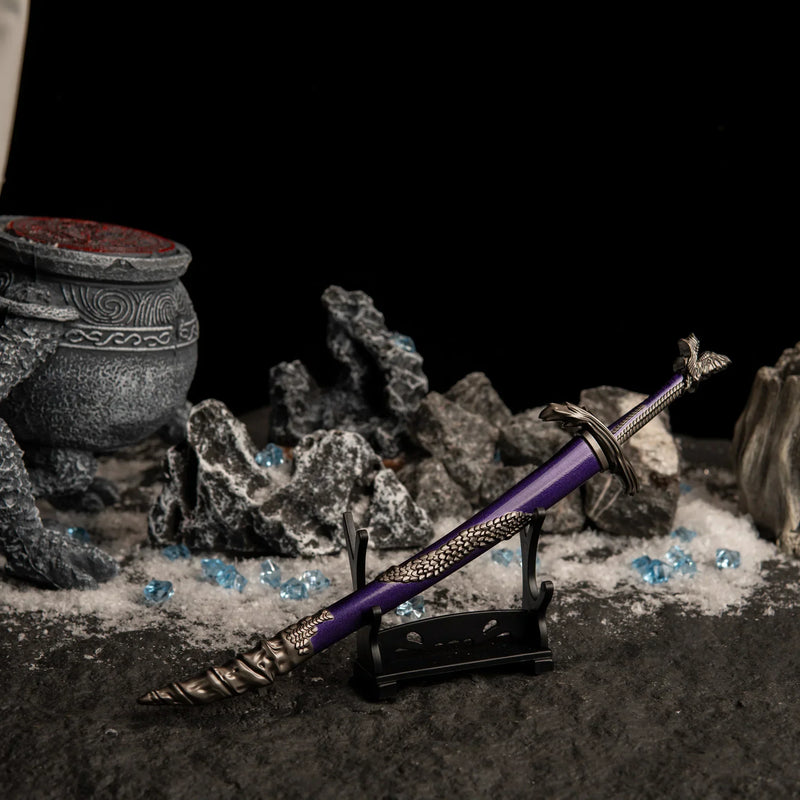 Side view of the Dragonscale Blade on a small display stand in a dark, snowy setting with blue crystals.