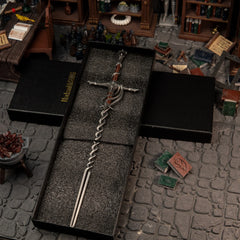 1/6 scale Fire Knight's Greatsword metal miniature inside a black gift box, placed in a Specimen Storehouse diorama.