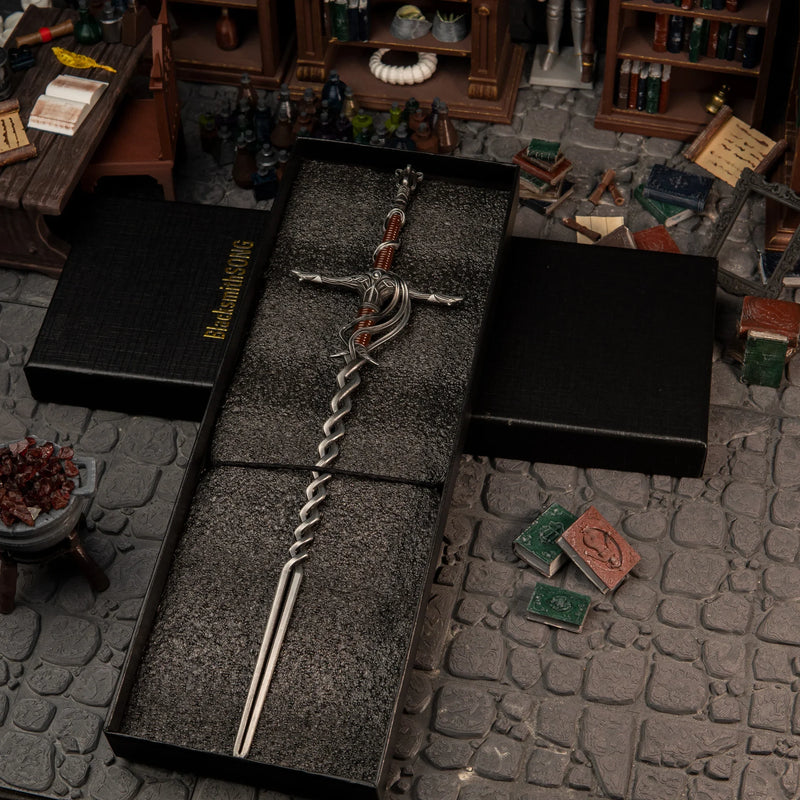 1/6 scale Fire Knight's Greatsword metal miniature inside a black gift box, placed in a Specimen Storehouse diorama.