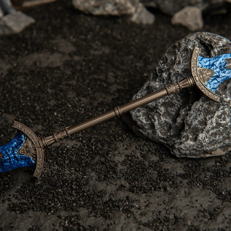 Macro detail of the central antique bronze hilt of the Gargoyle's Black Blades metal miniature.