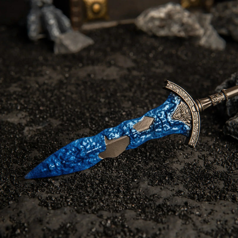 Close-up angled shot of the Gargoyle's Black Blades lying on black volcanic sand.