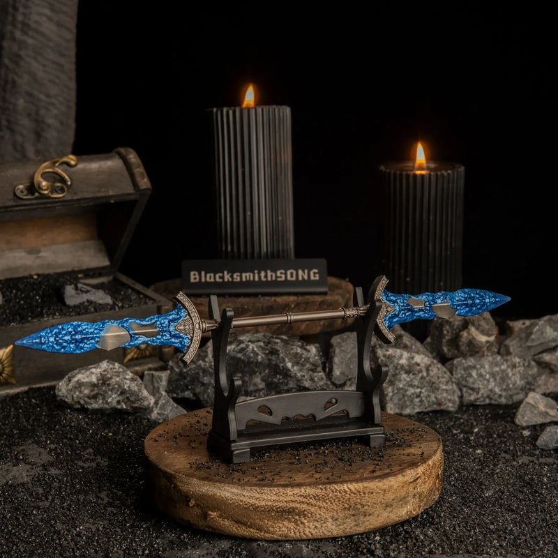 Slightly angled view of the Gargoyle's Black Blades on a display stand with black candles in the background.