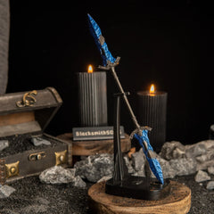 Vertical display of the Gargoyle's Black Blades on an upright black stand against a dark background with lit candles.