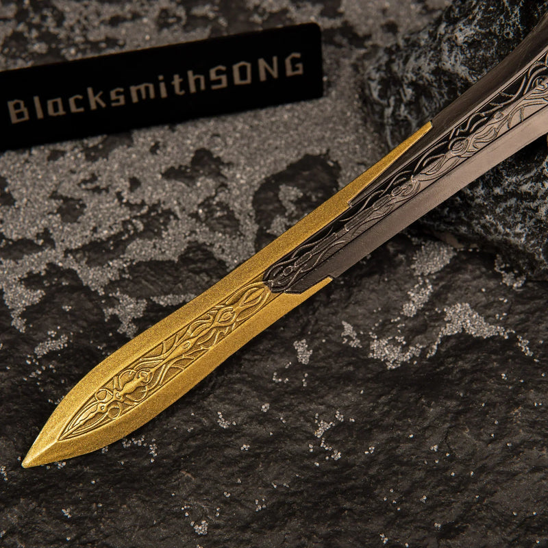 Detailed view of the transition point on the Gargoyle's Greatsword replica where the bronze blade meets the golden, mended tip section.