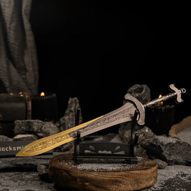 Close-up angled view of the Gargoyle's Greatsword on a small horizontal stand with lit black candles in the blurred background.