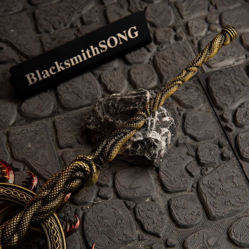 Ghiza's Wheel replica — twisted scale-textured shaft detail on dungeon stone, close-up.