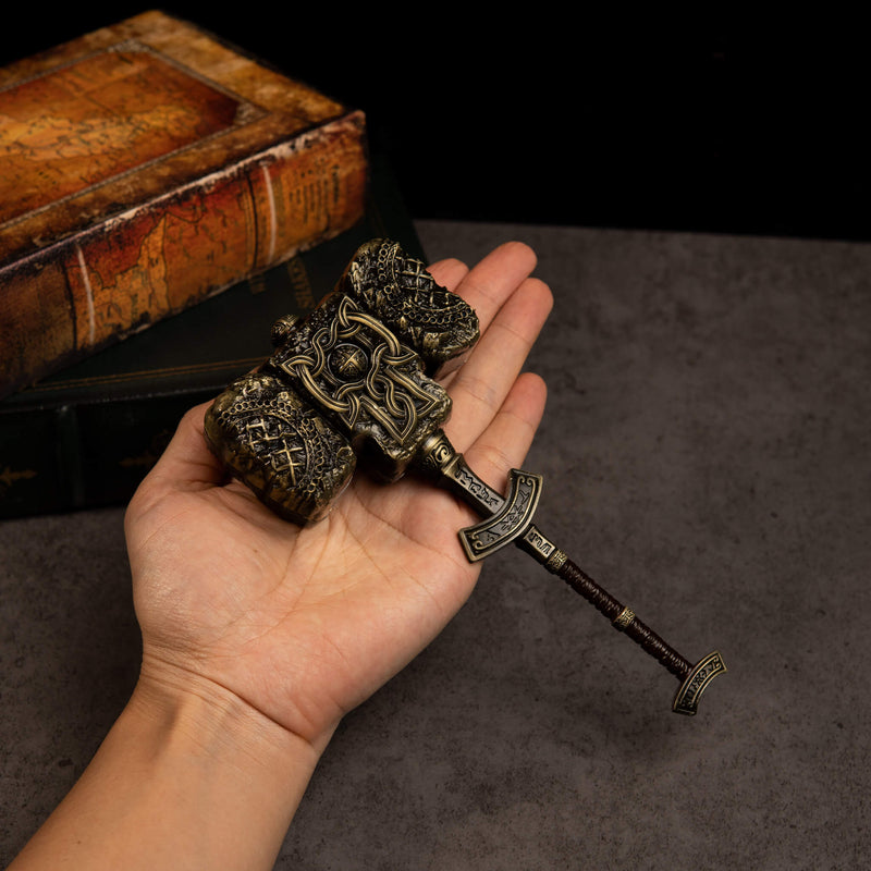 Giant-Crusher replica (17cm die-cast zinc alloy hammer) — held in hand for scale.