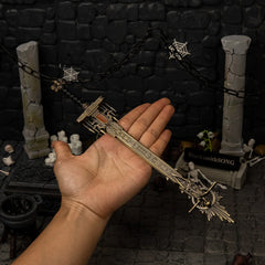 Golden Epitaph replica (30cm die-cast zinc alloy sword) — held in hand for scale.
