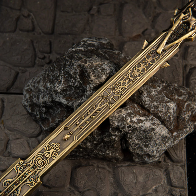 Golden Epitaph replica — engraved gold blade laid across the grave stones.