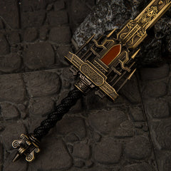 Golden Epitaph replica — ornate openwork guard, inlaid panel and black cord-wrapped grip, close-up.