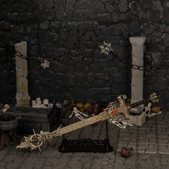 Golden Epitaph replica — displayed on the large stand between broken stone pillars.