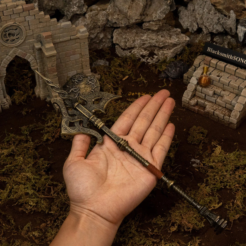 Golden Halberd replica (30cm die-cast zinc alloy halberd) — held in hand for scale.