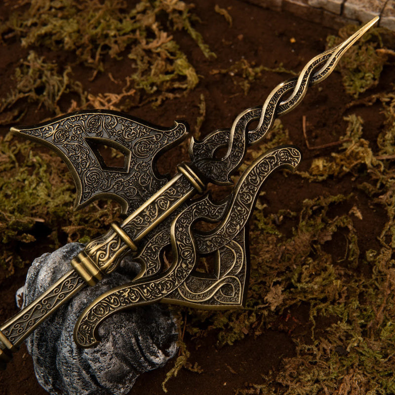 Golden Halberd replica — engraved axe head with openwork cutouts, close-up.