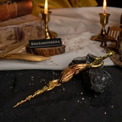 High-angle view of the Greatsword of Damnation on a textured dark surface with a white cloth and candle background.