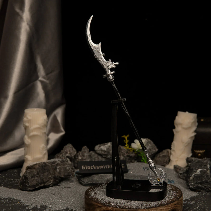Vertical display of the Loretta's War Sickle replica on an upright black stand, set against a dark background with grey sand and white candles.