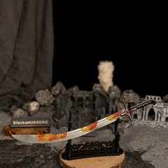 Nomad's Kilij metal curved sword displayed horizontally on a large black decorative stand over a circular wooden base in an ancient ruins diorama.