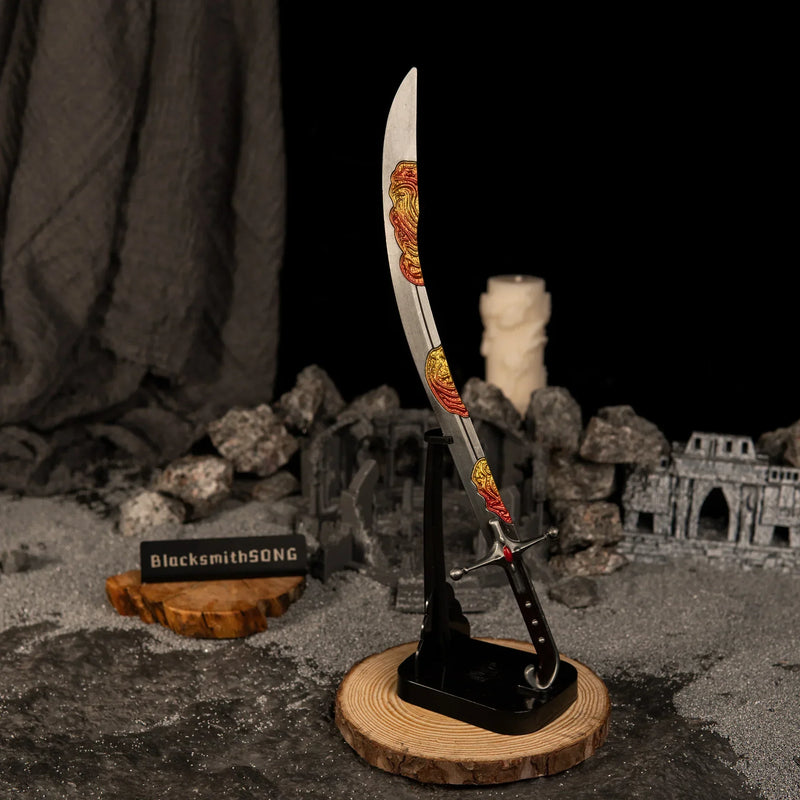 Vertical display of the Nomad's Kilij replica on an upright black stand, set against a dark background with grey sand and miniature ruins.
