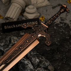 Macro close-up shot of the ornate crossguard and engraved lower blade of the Ordovis's Greatsword metal miniature.