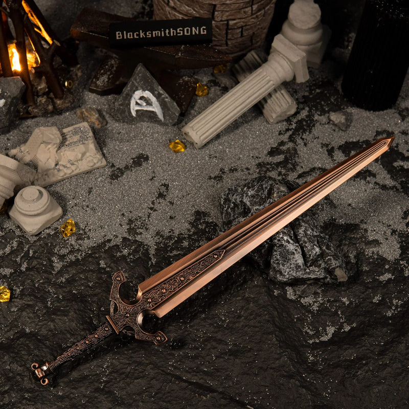 Wide angle view of the Ordovis's Greatsword miniature in a dark fantasy setting with broken stone pillars, glowing amber crystals, and a BlacksmithSONG sign.