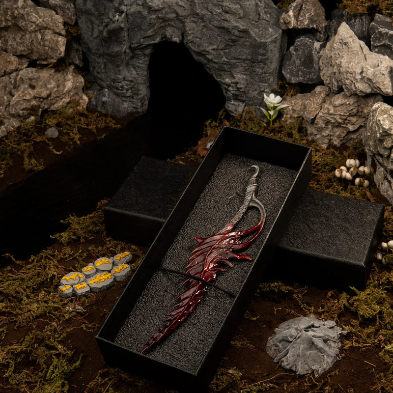 1/6 scale Reduvia Blood Blade metal miniature inside a black gift box, placed in a Murkwater River diorama.