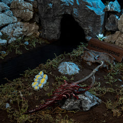 Reduvia replica displayed on a rock near a dark stream, with Murkwater Cave and a severed Bloody Finger in the background.
