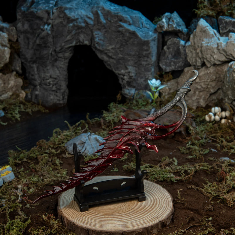 1/6 scale Reduvia metal miniature resting on a small horizontal wooden stand (sold separately) on mossy ground.