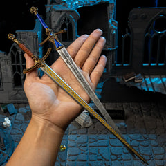 Rellana's Twin Blades replica (30cm die-cast zinc alloy swords) — held in hand for scale.