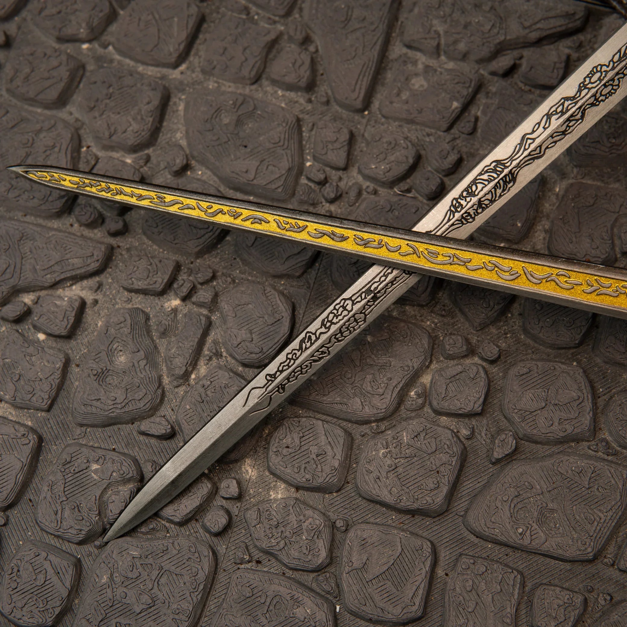 Rellana's Twin Blades replica — frost-etched hilt and pommel detail close-up