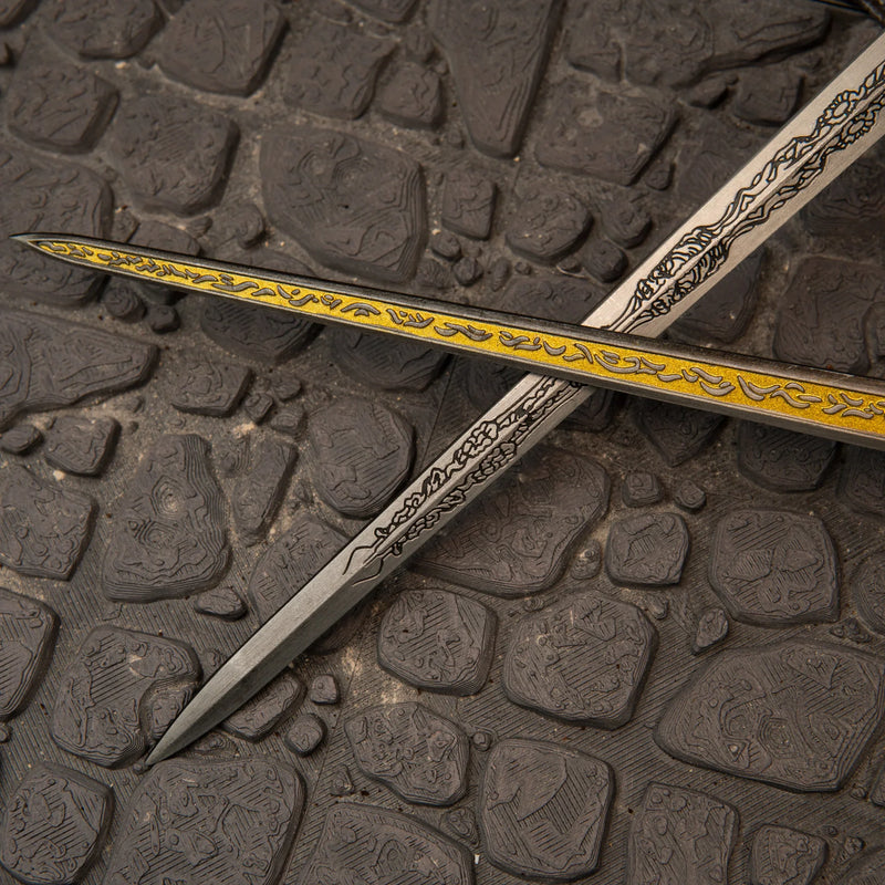 Rellana's Twin Blades replica — frost-etched hilt and pommel detail close-up.