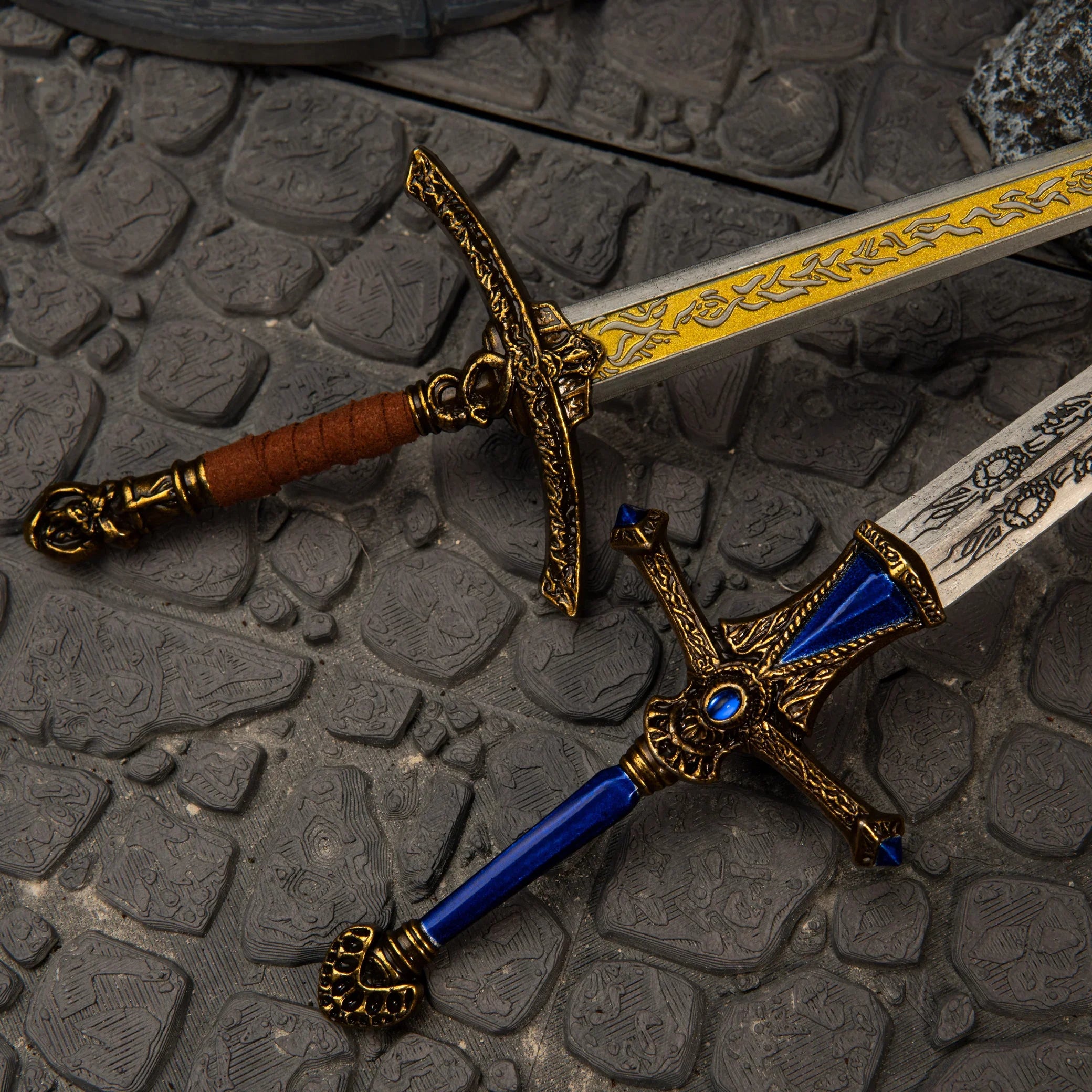Rellana's Twin Blades replica — flame-etched hilt and crossguard detail close-up