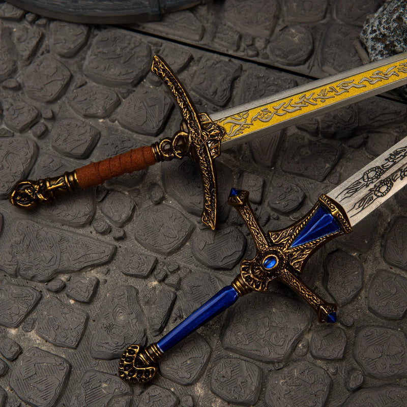 Rellana's Twin Blades replica — flame-etched hilt and crossguard detail close-up.