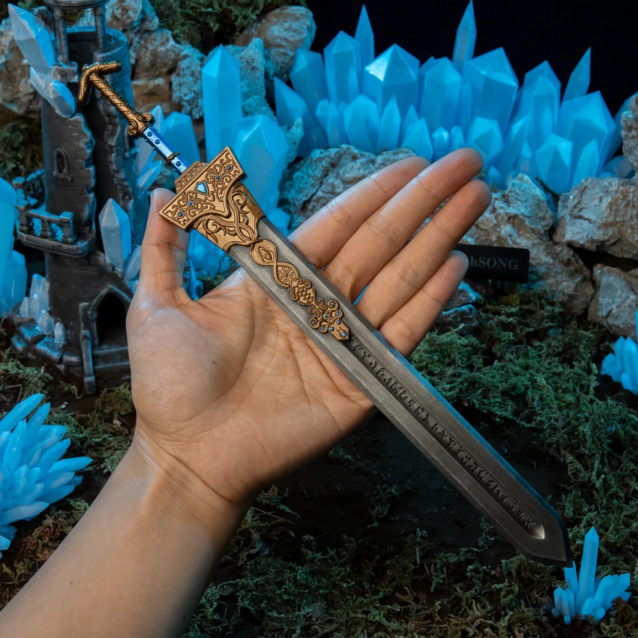 Royal Greatsword replica (30cm die-cast zinc alloy greatsword) — held in hand for scale.