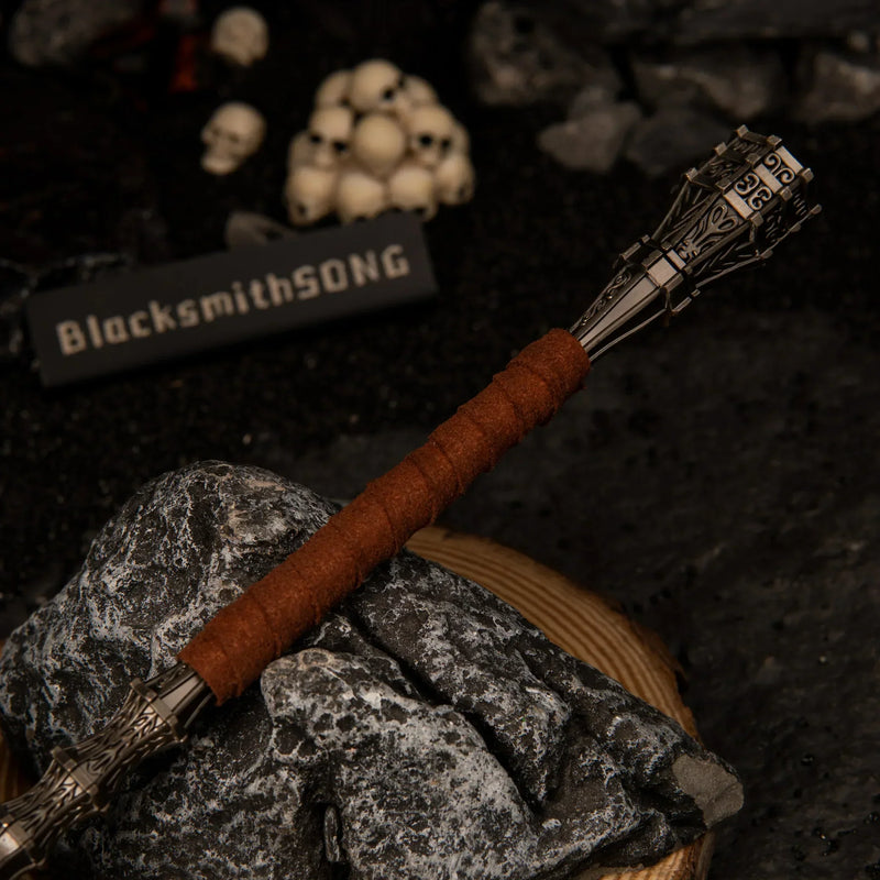 Close-up detail of the brown wrapped handle and textured metallic pommel of the Serpent-Hunter miniature weapon.