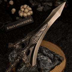Macro close-up shot of the wide metallic blade and ornate crossguard of the Serpent-Hunter metal replica.