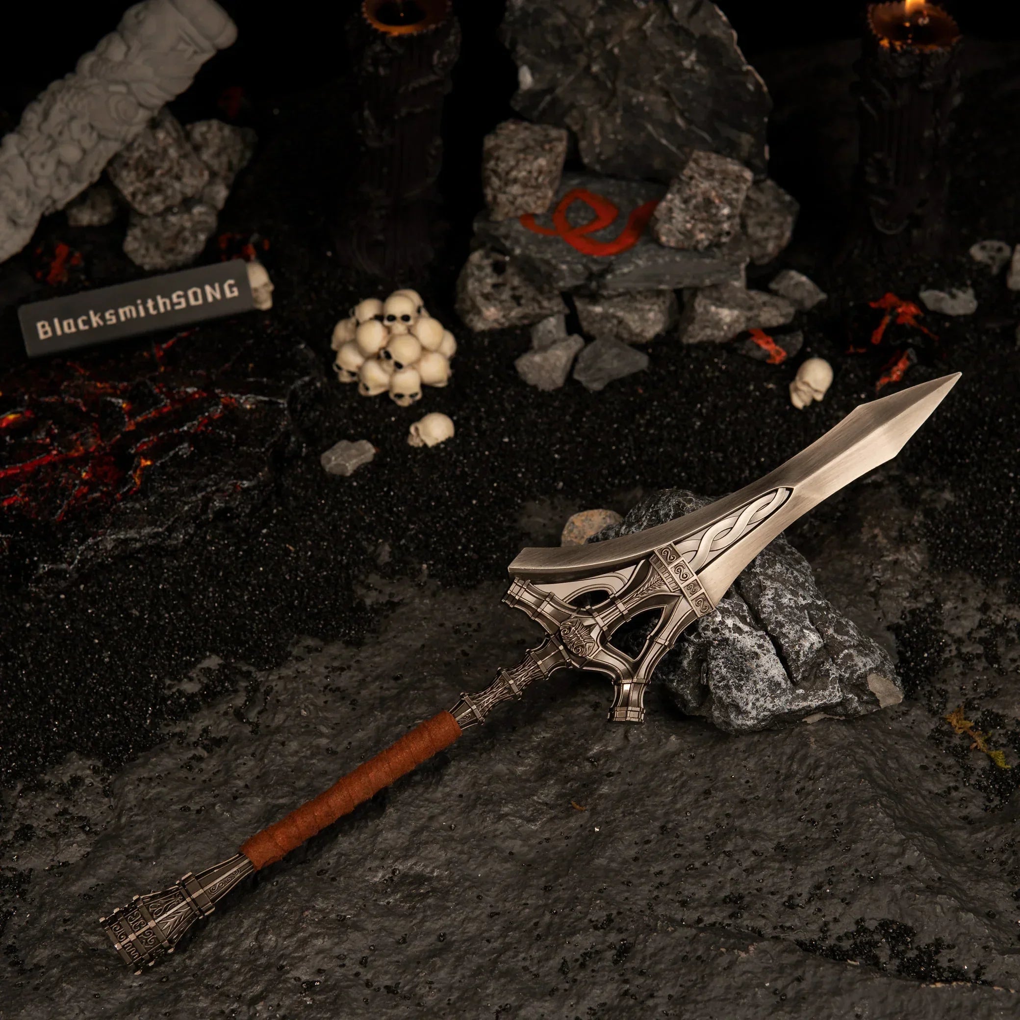 Angled view of the Serpent-Hunter metal spear in a diorama featuring glowing magma rocks and a stone with a red serpent rune.