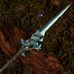 Macro close-up shot of the icy blue glintstone-style spearhead and the upper twisted handle of the Spear of the Dreaming metal miniature.