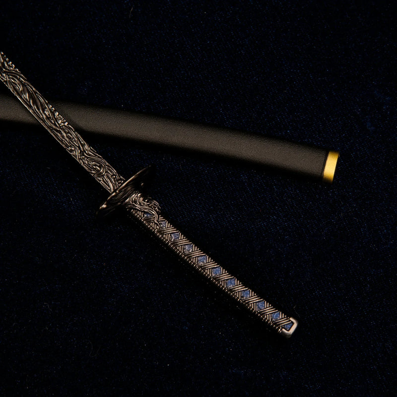 Macro close-up shot of the dark blue diamond-patterned handle and circular handguard of the Star Shadow katana replica.