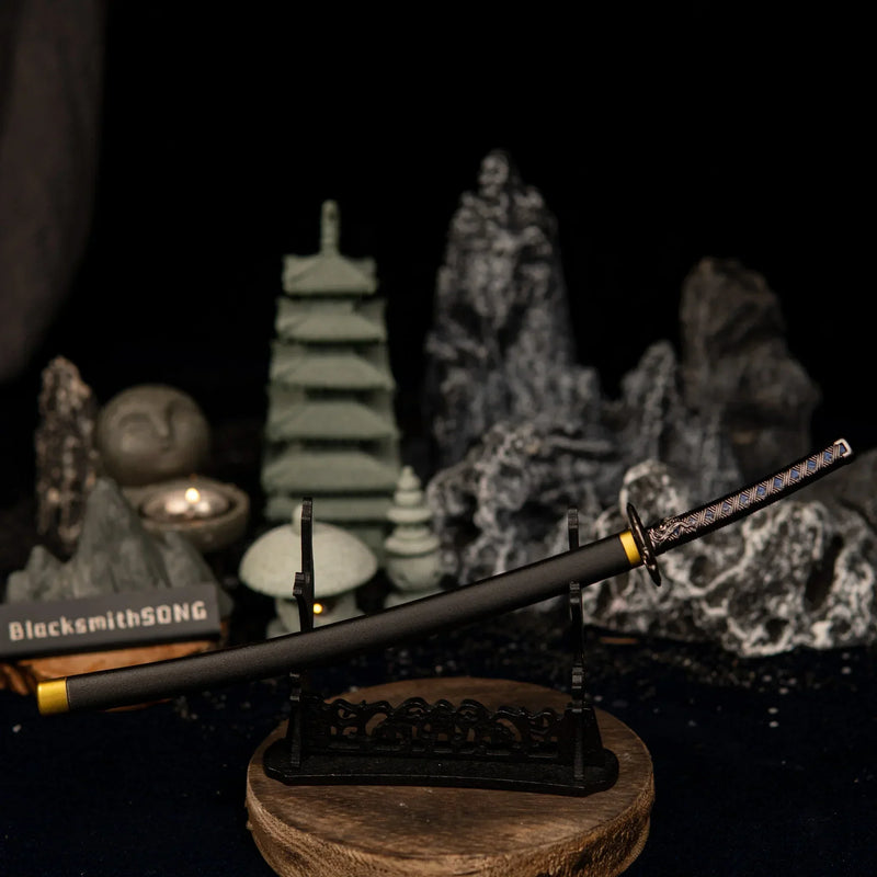 Star Shadow metal katana replica displayed horizontally on a large black decorative stand in a dark, Zen-style setting.