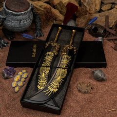 Paired set of 1/6 scale Starscourge Greatsword metal miniatures inside a black gift box on red Caelid sand.