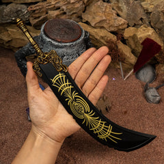 Human hand holding a single 30cm Starscourge Greatsword replica, showing its massive size and dense 311g weight.