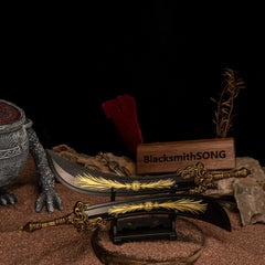 Starscourge Greatsword metal replicas displayed parallel on a small black stand, resting on red sand with rocks and a clawed statue in the background.
